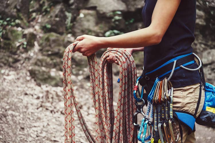 Gear check before departure — every piece of protection earns its place on the harness, same as every ounce in the pack