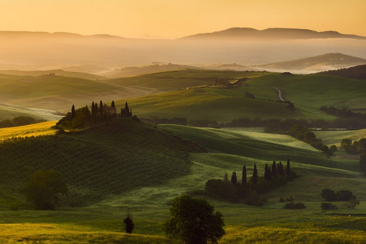 Orcia Valley at sunrise, Tuscany — the same pre-dawn stillness that greets every Alpine pass cyclist before the first big climb