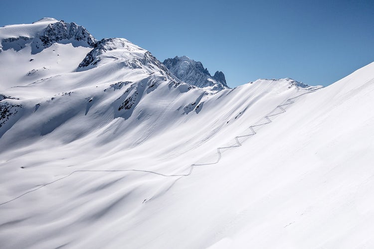 First tracks on an untracked slope — the reward for starting before anyone else