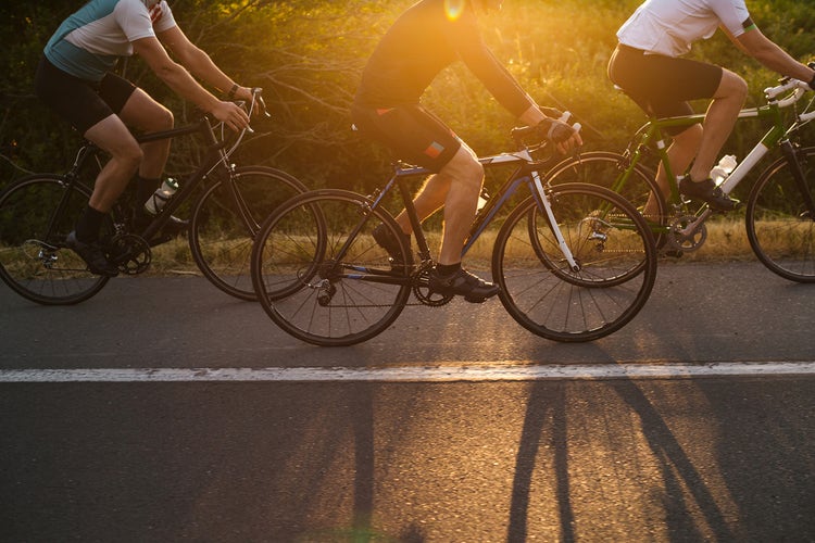 Road cyclists riding hard through the high passes
